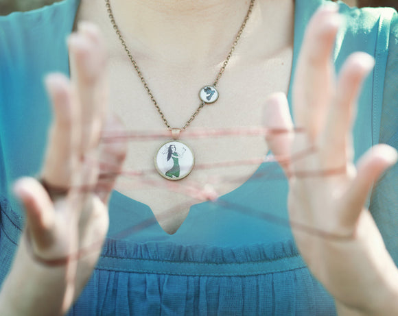 girl with bird necklace